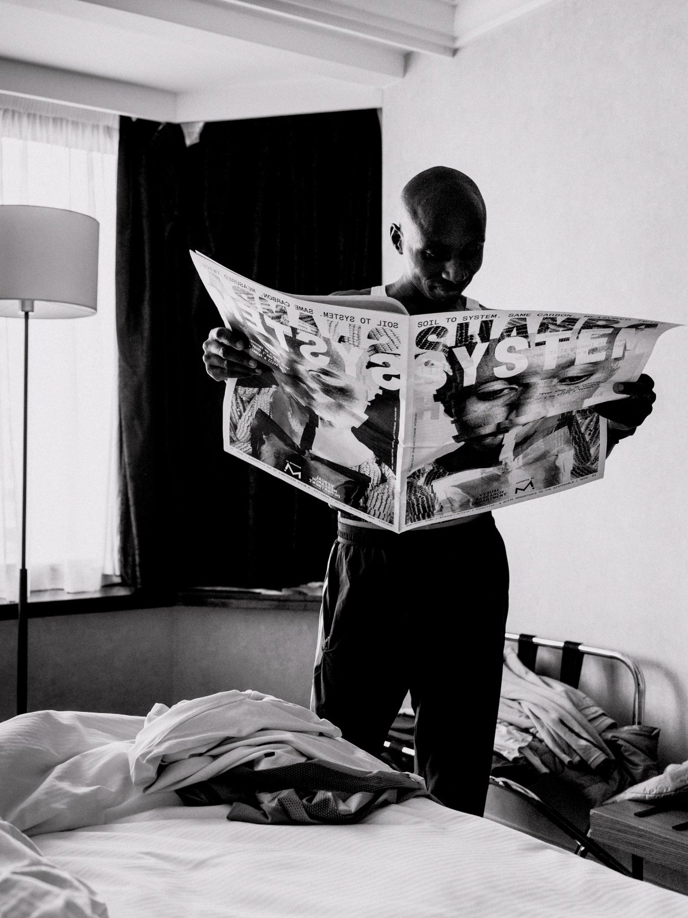 Sabastian Sawe holding the Shamba System newspaper.
